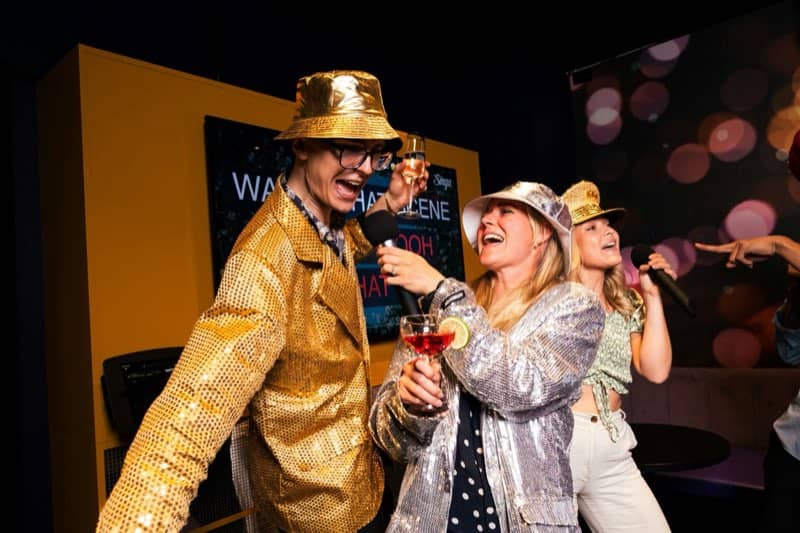 Karaoke night in sequins, mid-chorus