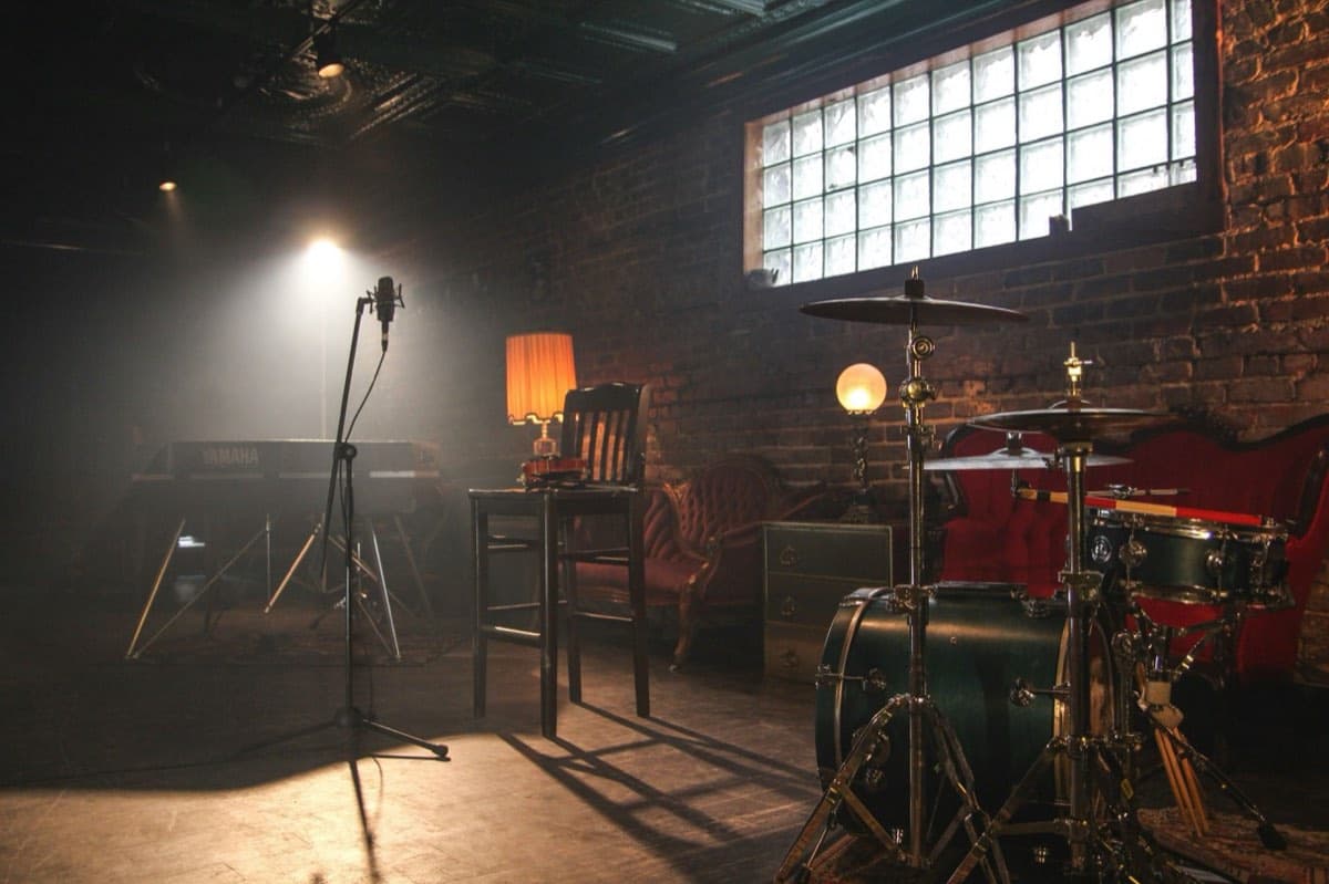 A brick-walled stage set up and waiting before a show